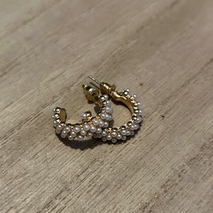 Gold hoop earrings covered in pearls